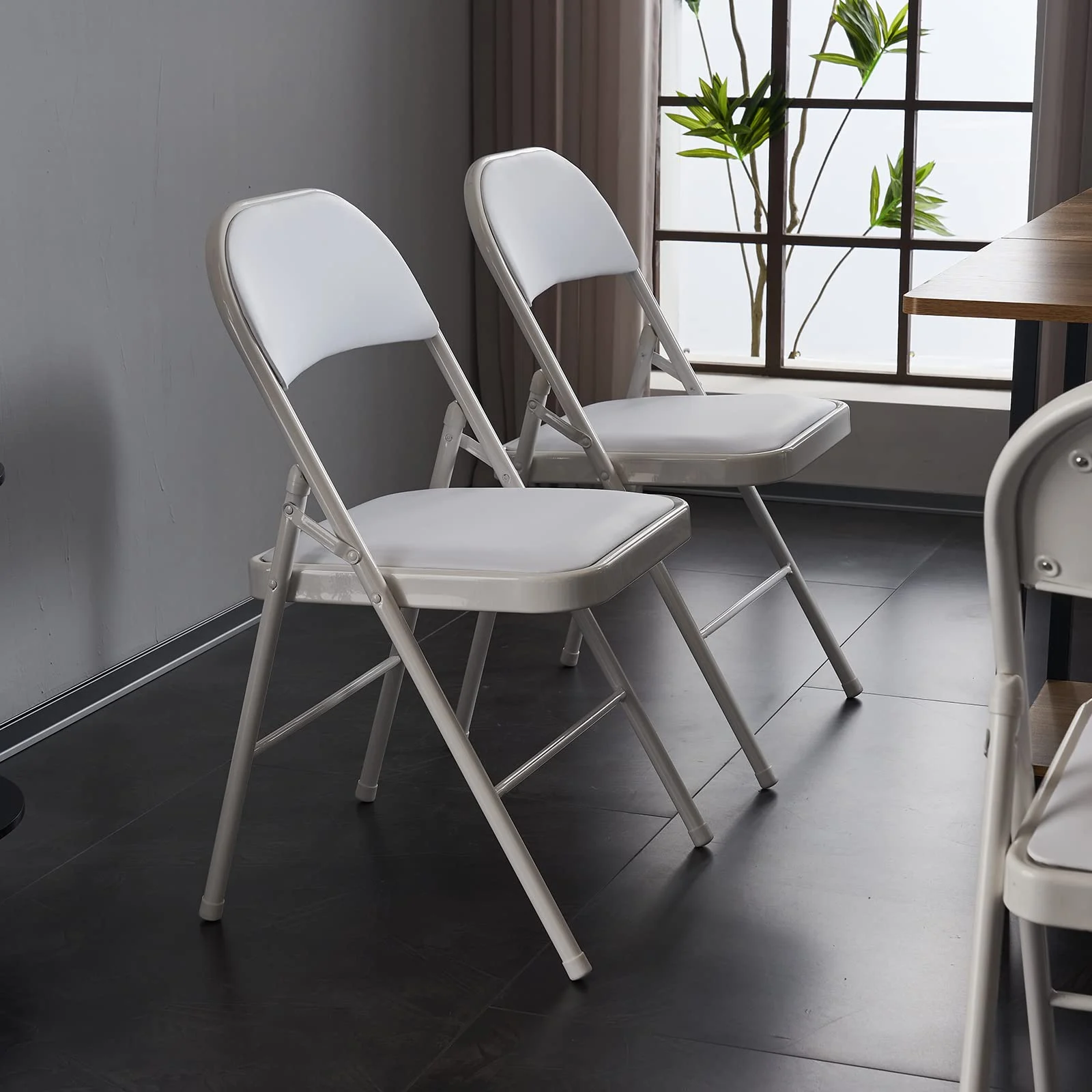 Karl Home Padded Folding Chairs, 4 Pack in a room